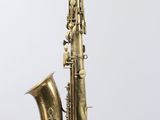 a close up of a brass saxophone on a white background