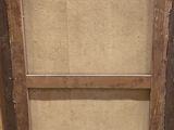 a picture of an old wooden cabinet with a glass door