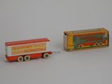 two toy trucks that are sitting next to each other
