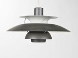 a grey and white pendant light hanging from a ceiling