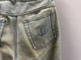 denim pants with the letter c on the back of the pants
