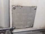 a metal plaque on the side of a white truck