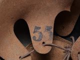 a baseball glove with a number on the inside of it
