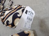 a picture of a bikini with a price tag on it
