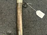 a close up of a metal pipe with a tag attached to it
