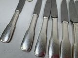 five knives and six knives on a table