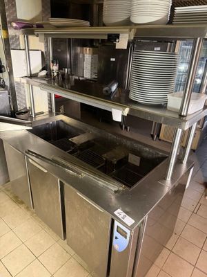 a kitchen with stainless steel cabinets and a counter top
