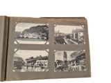 an old book with pictures of a town and a river