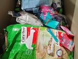 a box full of cat food and other items in it