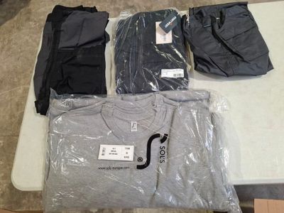 a lot of t - shirts that are on a table