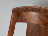 a close up of a wooden chair with a wooden seat