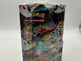 a box of pokemon trading cards with a white background