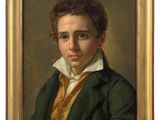 portrait of a young man in a green coat by person