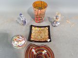 a bowl, plate, and bowl of food on the floor