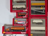 many different types of toy trucks in the box