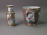 two vases sitting next to each other on a table