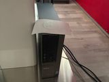 a computer sitting on top of a table in a room