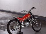 a red motorcycle that is parked in a parking garage