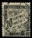 a stamp with a picture of a man on it on a black background