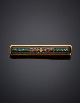 a gold and enamel bar with a design of flowers and leaves