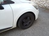 a white car parked on the side of the road