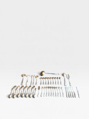 a lot of screws and screws on a white surface
