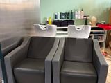 two chairs that are sitting in front of a counter