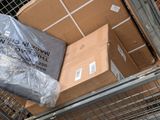 a cart full of boxes sitting on top of a shopping cart