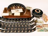 a purse and a pair of headphones sitting on a table