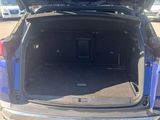 a trunk of a car with luggage in the trunk