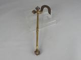 a small metal object that is on a clear stand