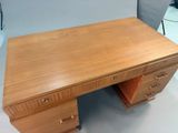 an image of a wooden desk with drawers and drawers