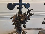 two statues of birds and a bird on a table