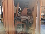 a wooden cabinet with a lot of items inside of it