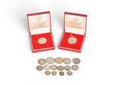 two red boxes with silver coins and a red box with silver coins