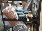a cart with many items in it in a warehouse