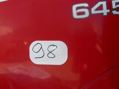 a sticker on the side of a red bus