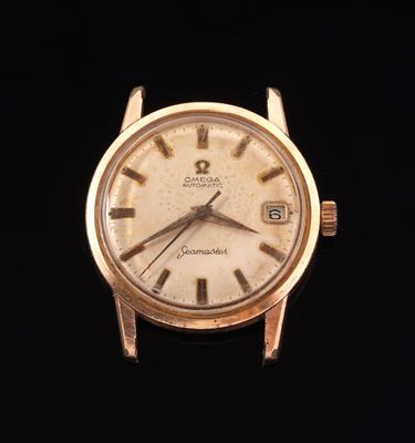 an image of a gold watch with roman numerals