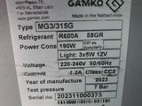 a label on the back of a machine that says gamiko