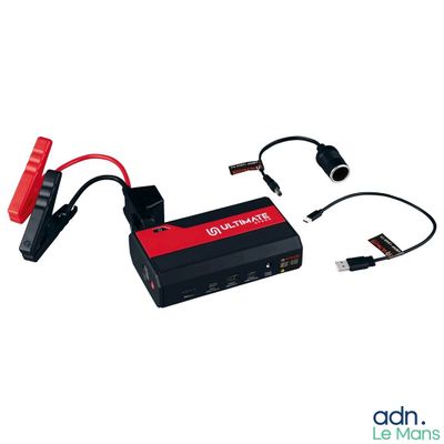 une image représentant un chargeur de batterie rouge et noir auquel est branché un câble
