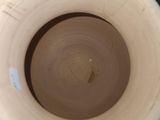 a close up of a vase on a table