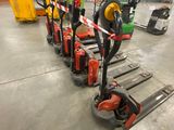 many different types of forklifts in a warehouse