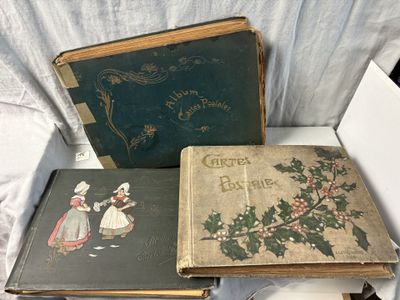 three books sitting on a table next to each other