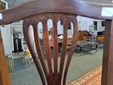 an image of a chair in a room with a rug