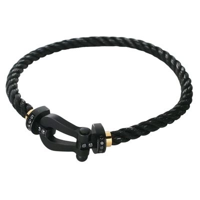 a close up of a black leather bracelet with a metal clasp