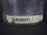 a glass jar with a label on it that says dangerux