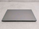 a laptop that is sitting on a white surface