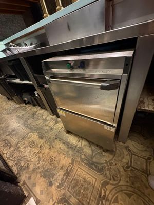 a stainless steel oven in the middle of a kitchen