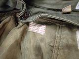 an image of a close up of a jacket with a tag on it