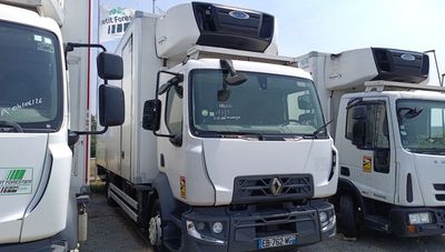 three trucks that are parked next to each other